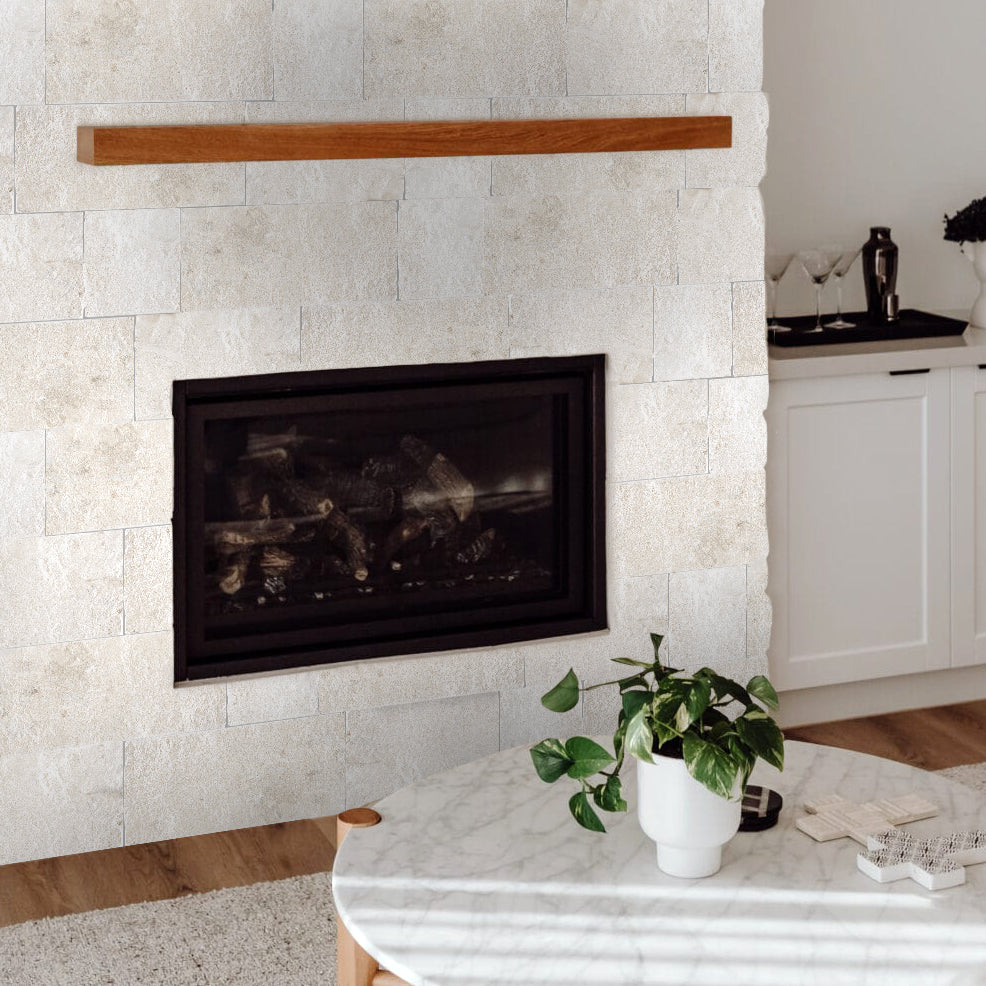 Lymra limestone corner veneer featured in a contemporary space with sculpted splitface texture