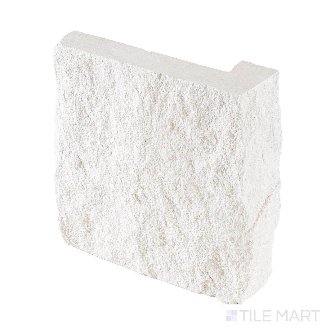 Full-piece detail of Lymra limestone 8x7.5 corner veneer featuring dimensional splitface texture