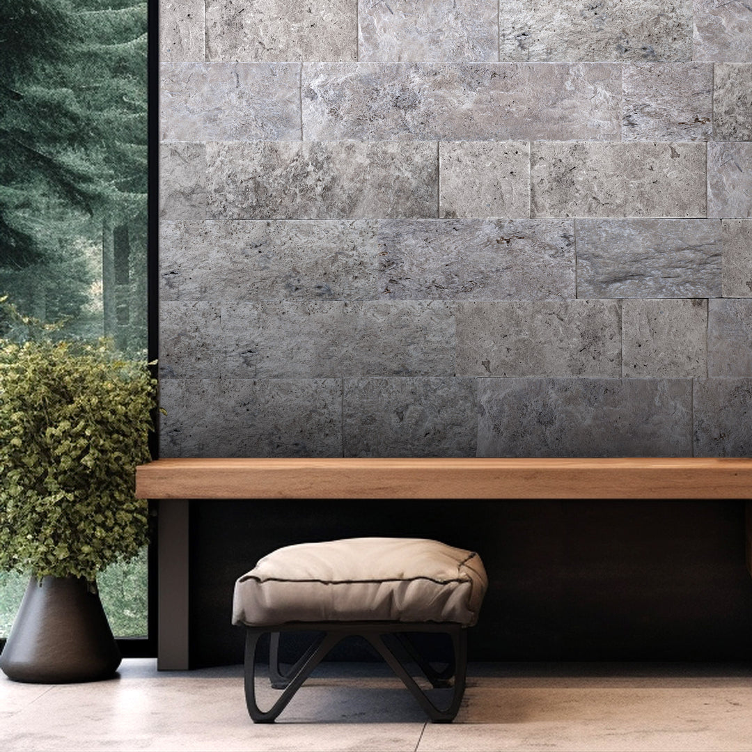 Silver travertine veneer in random splitface layout featured in a refined interior with natural tonal movement