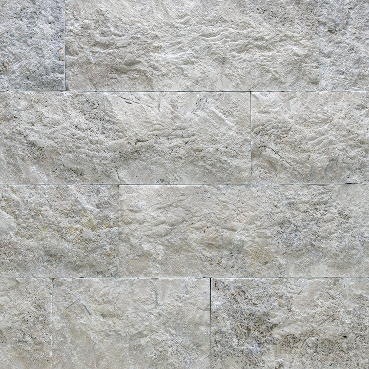 Silver travertine veneer in an 8x random splitface format with cool tones and natural depth
