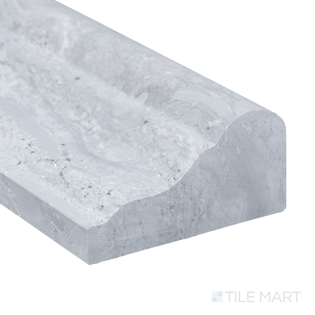 A detailed corner view of Haisa Blue Marble 2x12 honed grand chair rail showing soft veining and elegant blue-grey hue.