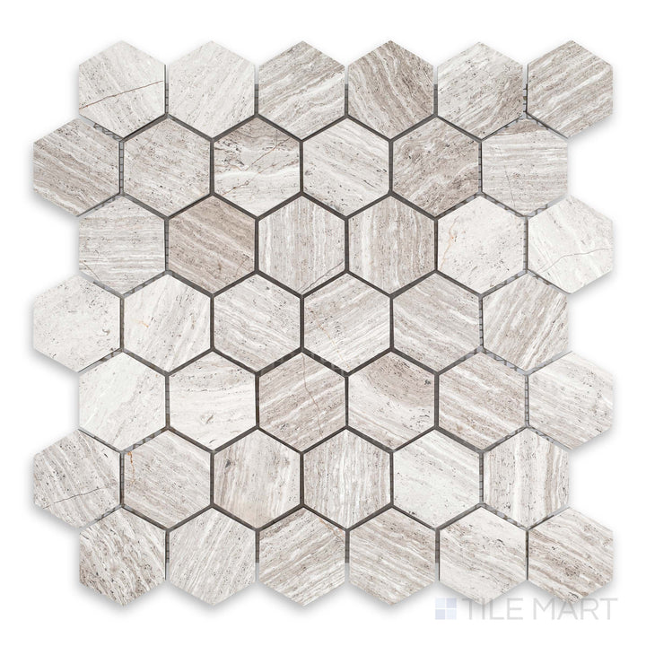 Top-down detail of Haisa Light marble 2-inch hexagon mosaic with honed finish and soft stone texture