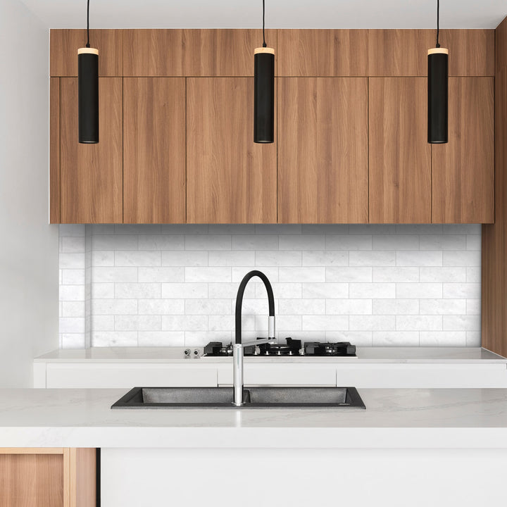 Polar White marble 4x12 polished tile styled in an elevated interior highlighting luminous surface detail