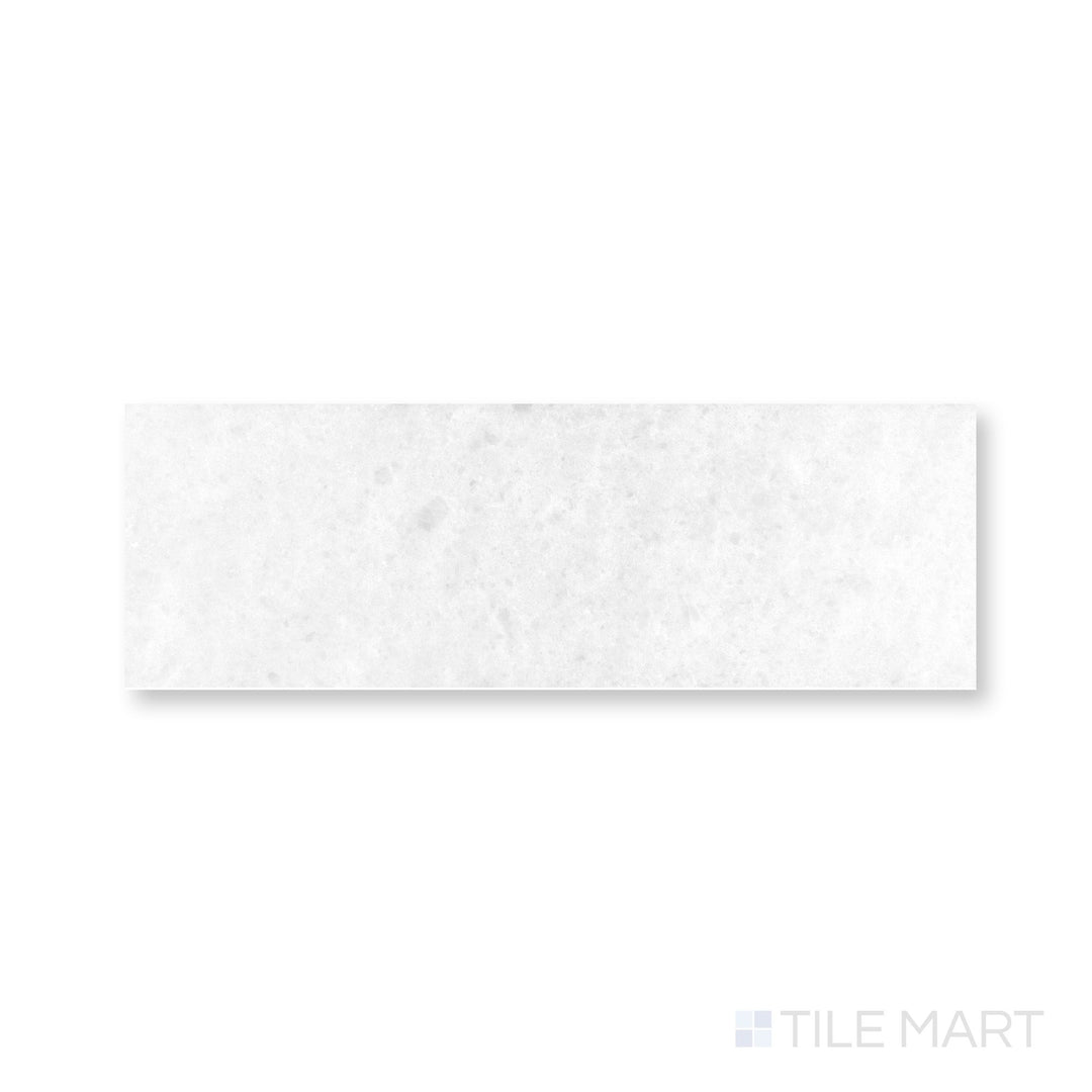 Detail of Polar White marble 4x12 tile showcasing polished surface and crisp reflective edges