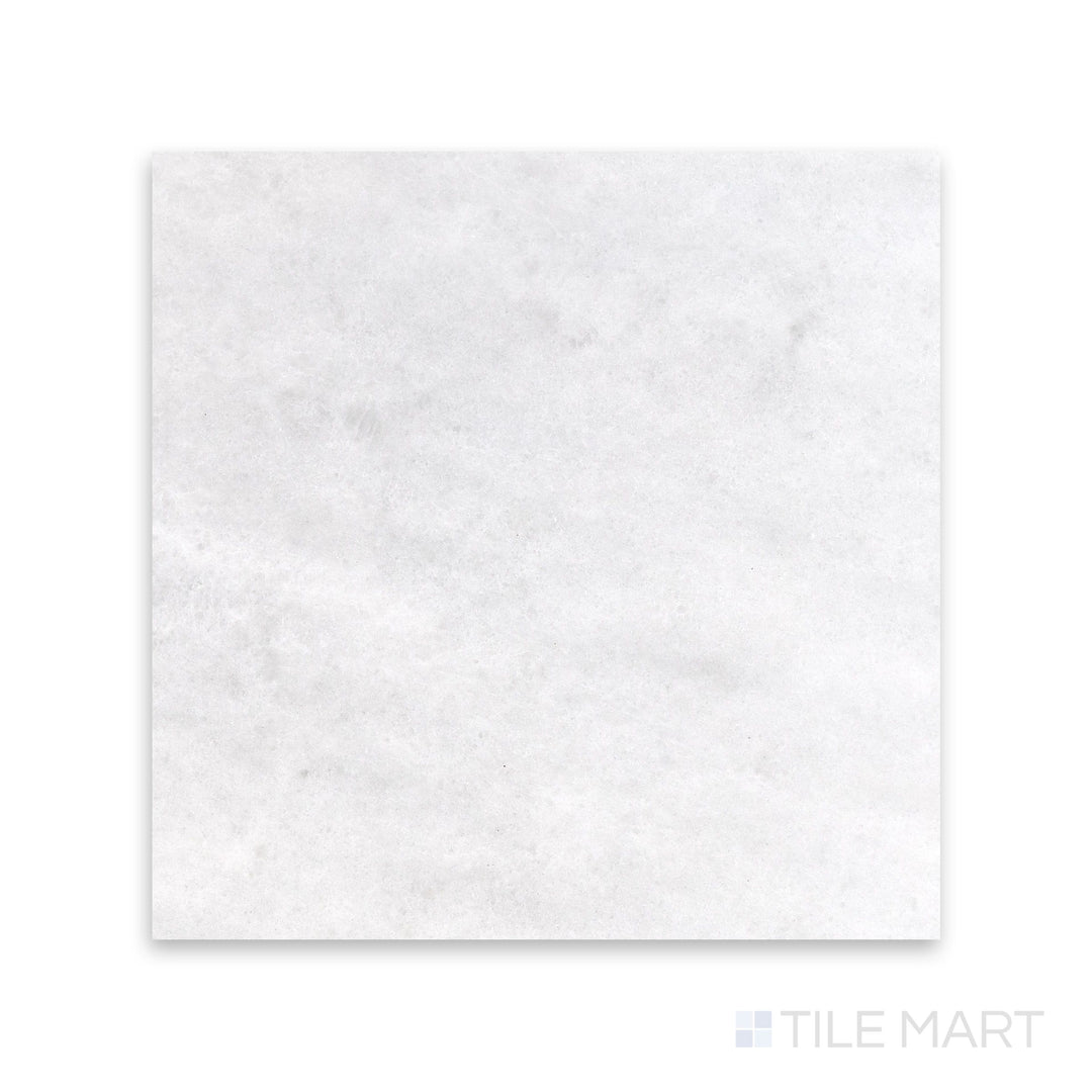 Close view of Polar White marble 12x12 tile with honed finish and gentle natural variation
