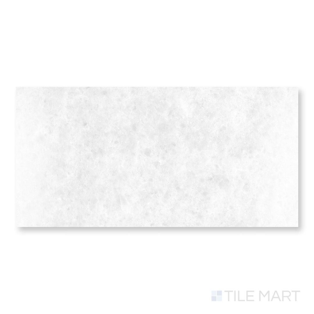 Close-up of Polar White marble 18x36 tile showcasing polished surface and elongated stone pattern