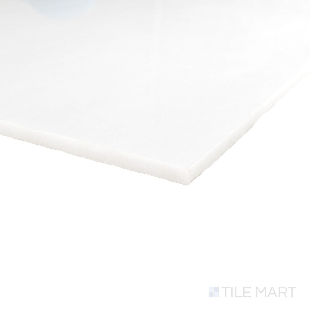 Corner detail of Polar White marble 24x24 tile with polished finish and luminous stone character