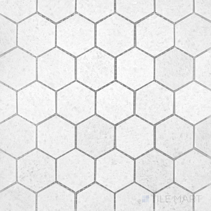 Polar White marble mosaic with a honed finish and soft geometric stone pattern