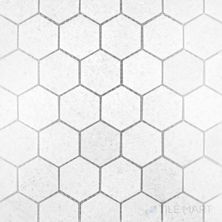 Polar White marble mosaic with a polished finish and soft geometric stone pattern