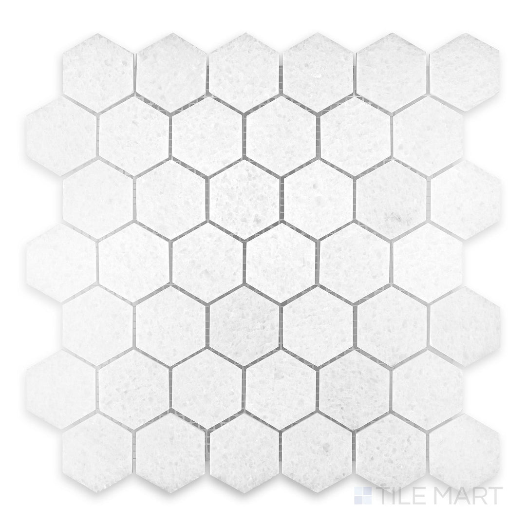 Close view of Polar White marble mosaic with polished finish and crisp reflective surface