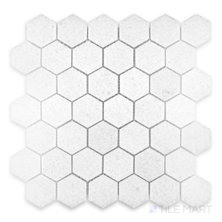 Close view of Polar White marble mosaic with polished finish and crisp reflective surface