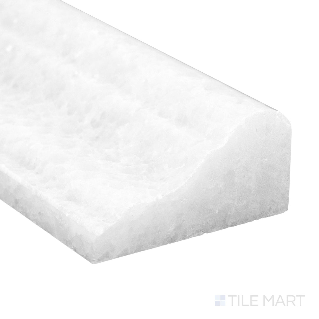 A refined corner capture of Polar White Marble 2x12 polished grand chair rail with glossy finish and bright surface tone.