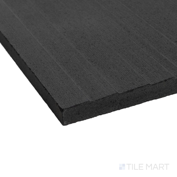 Ravello Black basalt 6x24 fence tile shown in corner view highlighting linear texture and deep stone tone