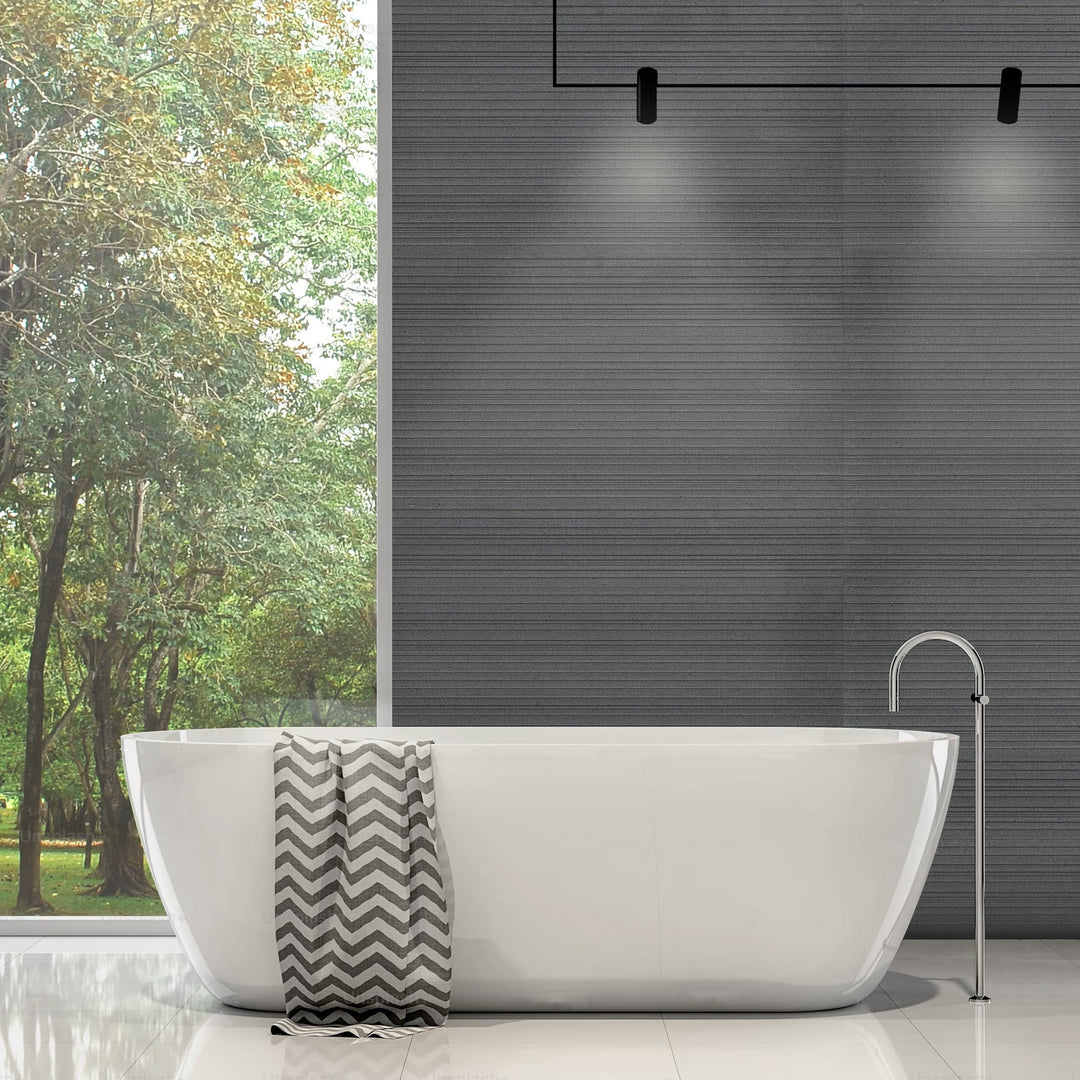 Ravello Black basalt 18x36 horizon tile styled in an elevated interior emphasizing dramatic scale and surface texture