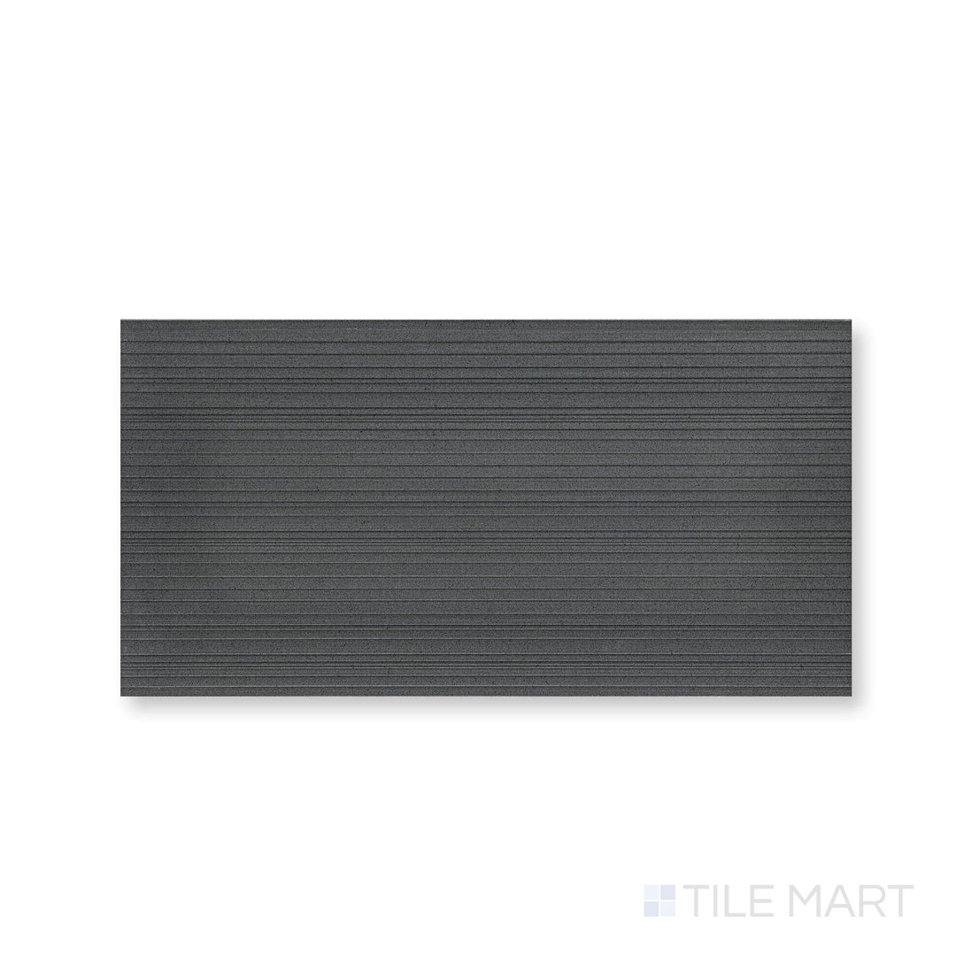 Close view of Ravello Black basalt 18x36 horizon tile showcasing expansive scale and textured surface