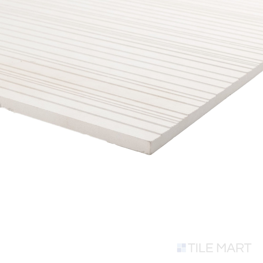 Corner angle of Ravello Lymbra limestone 12x24 horizon tile with warm tones and refined linear texture