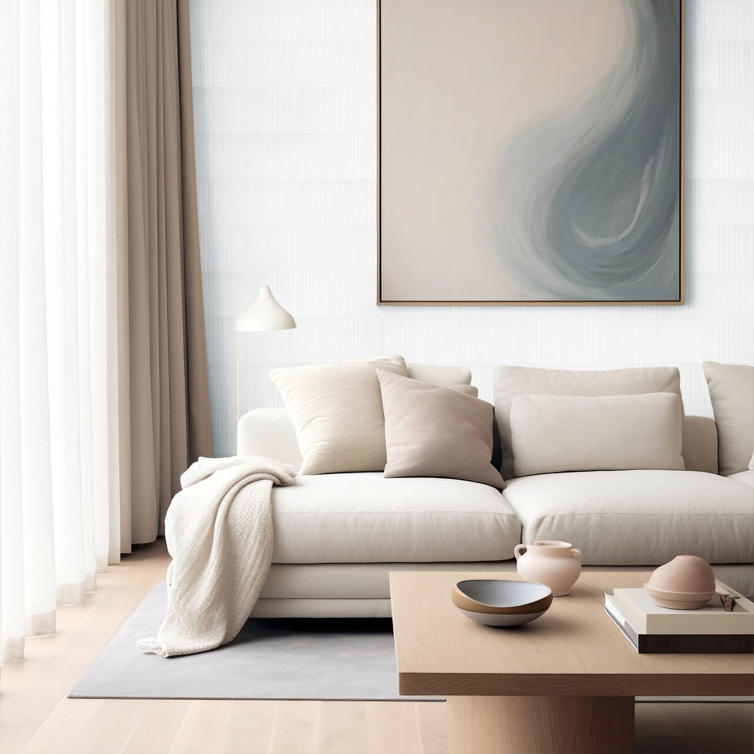 Ravello White Carrara marble 6x24 fence tile styled in a bright interior with crisp veining and architectural texture