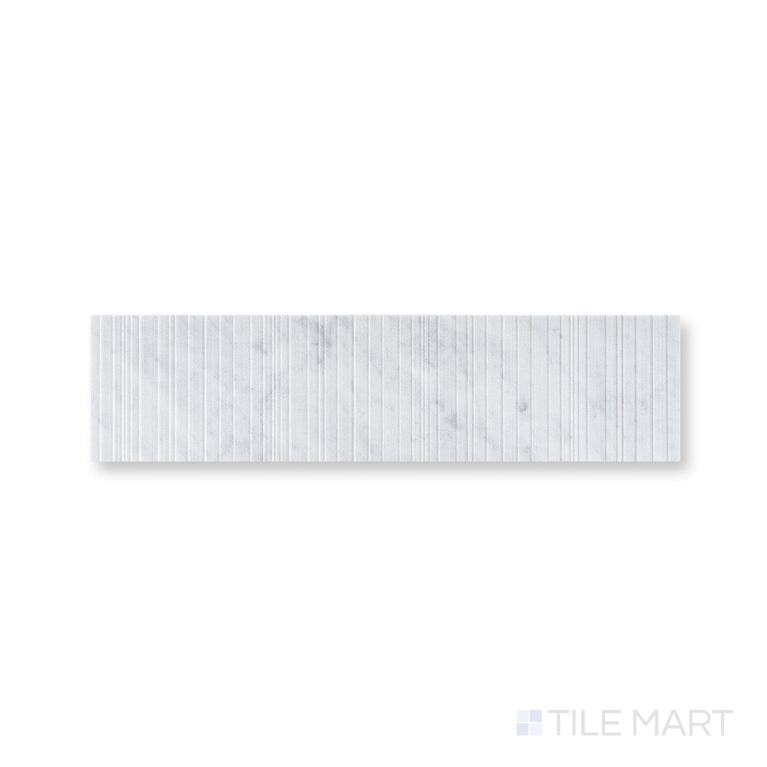 Close-up of Ravello White Carrara marble 6x24 fence tile highlighting crisp veining and architectural texture
