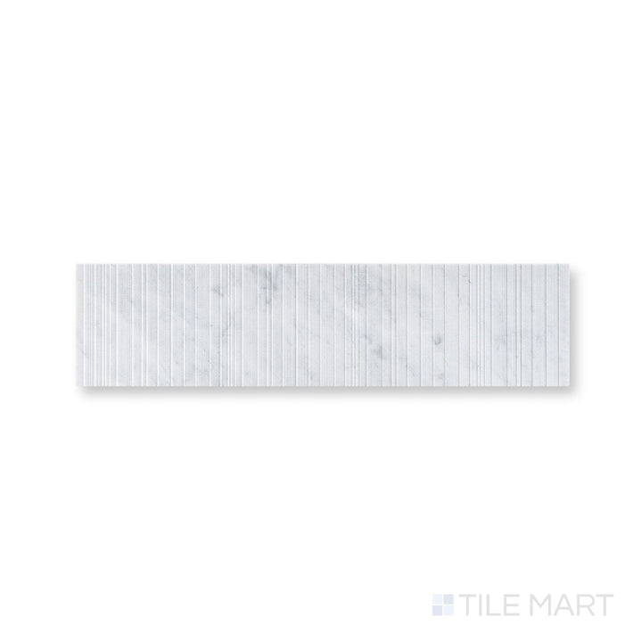 Close-up of Ravello White Carrara marble 6x24 fence tile highlighting crisp veining and architectural texture