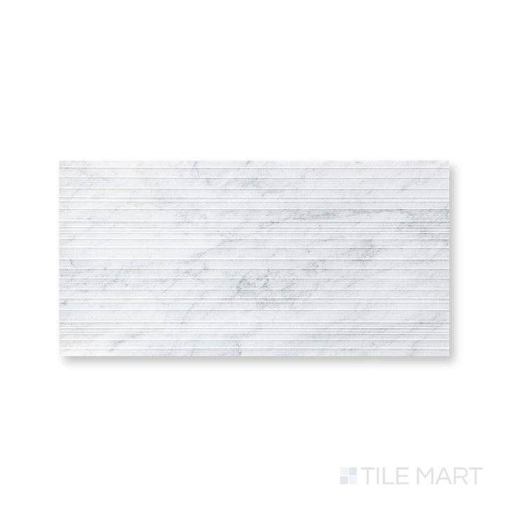 Detail of Ravello White Carrara marble 12x24 horizon tile with clean lines and classic stone movement