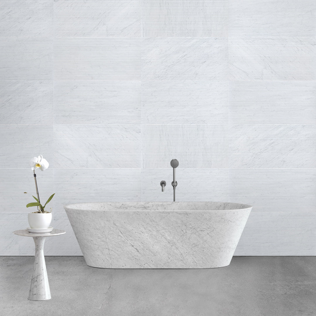 Ravello White Carrara marble 18x36 horizon tile displayed in a contemporary interior emphasizing bold scale and refined veining