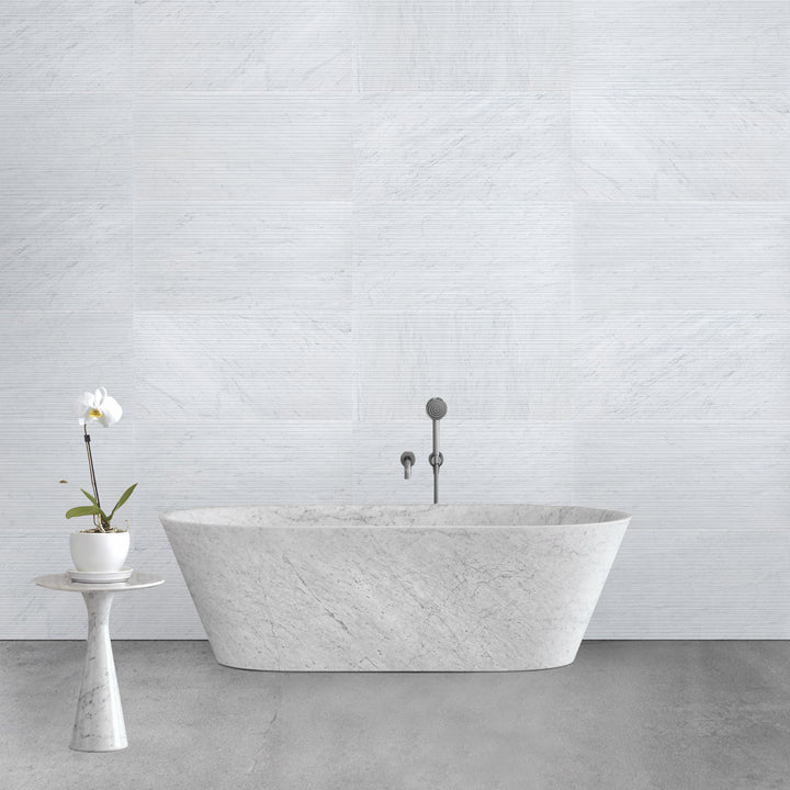 Ravello White Carrara marble 18x36 horizon tile displayed in a contemporary interior emphasizing bold scale and refined veining