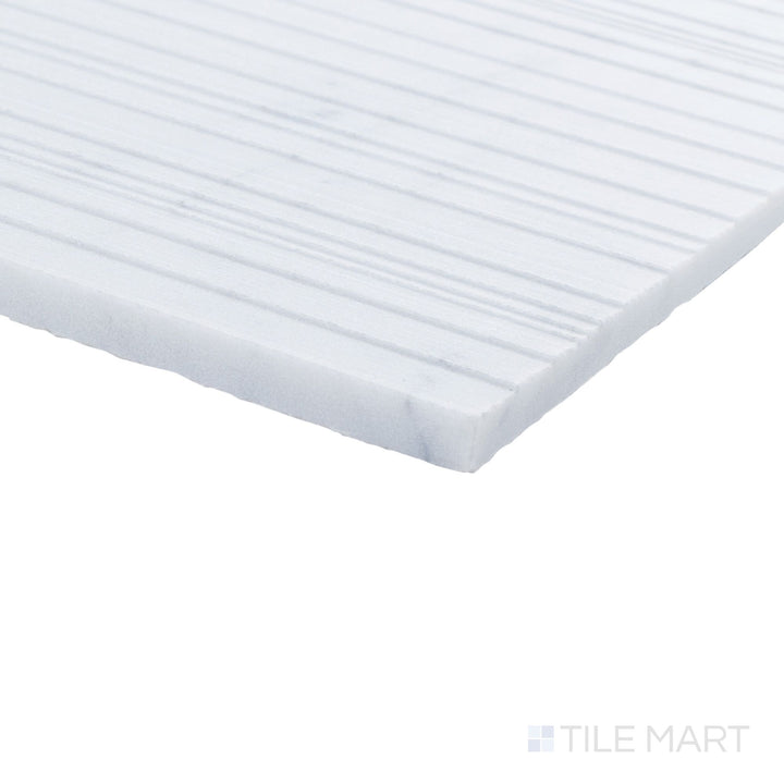 Corner view of Ravello White Carrara marble 18x36 horizon tile highlighting bold scale and refined marble character