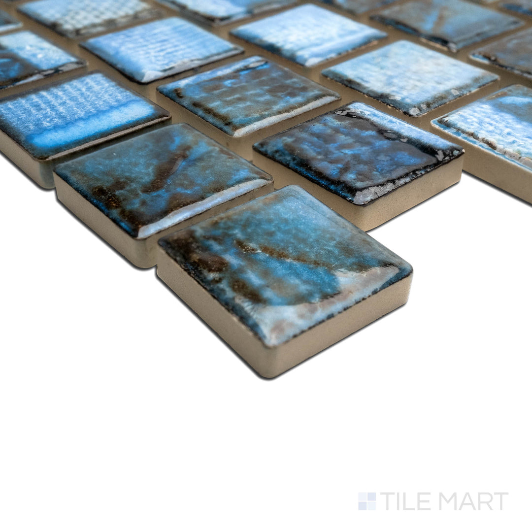 Close-up of the corner showcasing the TOKYO ASPEN BLUE 1X1, capturing the precision-cut edges and rich texture of the PORCELAIN material. The edges offer a sleek, sophisticated finish for detailed designs.