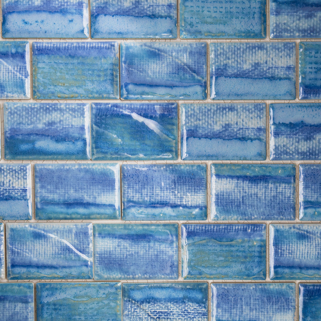 Skyward shot offering a glimpse of the TOKYO ICY BLUE 2X3 in SEMI GLOSS finish. The finish adds depth and dimension, enhancing the tile’s unique surface.