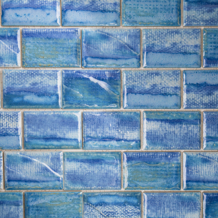 Skyward shot offering a glimpse of the TOKYO ICY BLUE 2X3 in SEMI GLOSS finish. The finish adds depth and dimension, enhancing the tile’s unique surface.