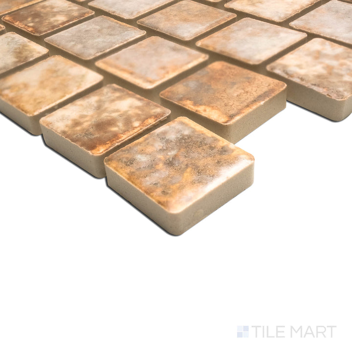 A unique angle highlighting the fine texture of JOYA 100 GOLD 1X1, capturing the precision-cut edges and rich texture of the PORCELAIN material. The clean lines provide a sharp, polished look for intricate tiling projects.