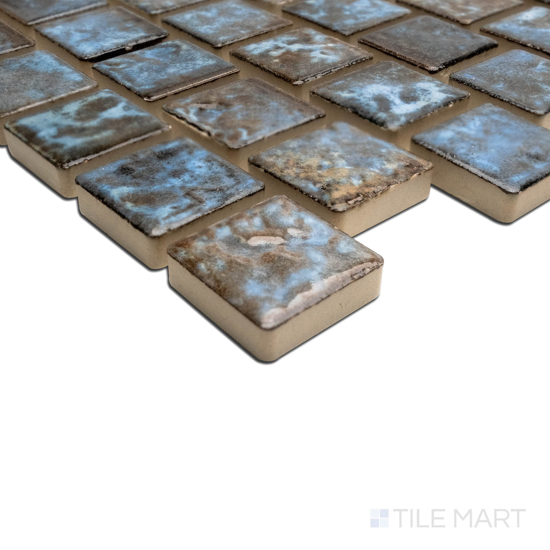 A sharp corner image displaying the JOYA 100 COTTO 1X1, capturing the precision-cut edges and rich texture of the PORCELAIN material. The corner detail showcases the precision and quality of this fine material.