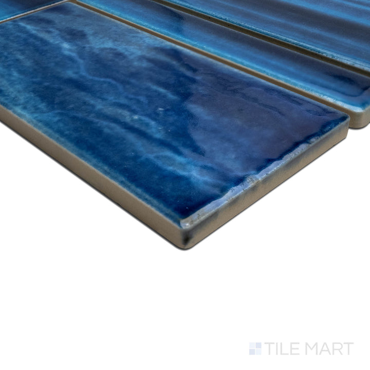 Angled view focusing on the details of OMEGA BLUE HORIZON, capturing the precision-cut edges and rich texture of the PORCELAIN material. The edges offer a sleek, sophisticated finish for detailed designs.