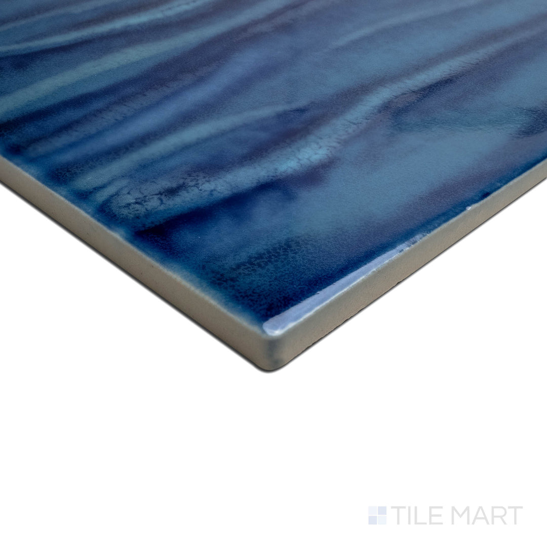 Angled view focusing on the details of KAWA AQUA BLUE 6X6, capturing the precision-cut edges and rich texture of the PORCELAIN material. The clean lines provide a sharp, polished look for intricate tiling projects.