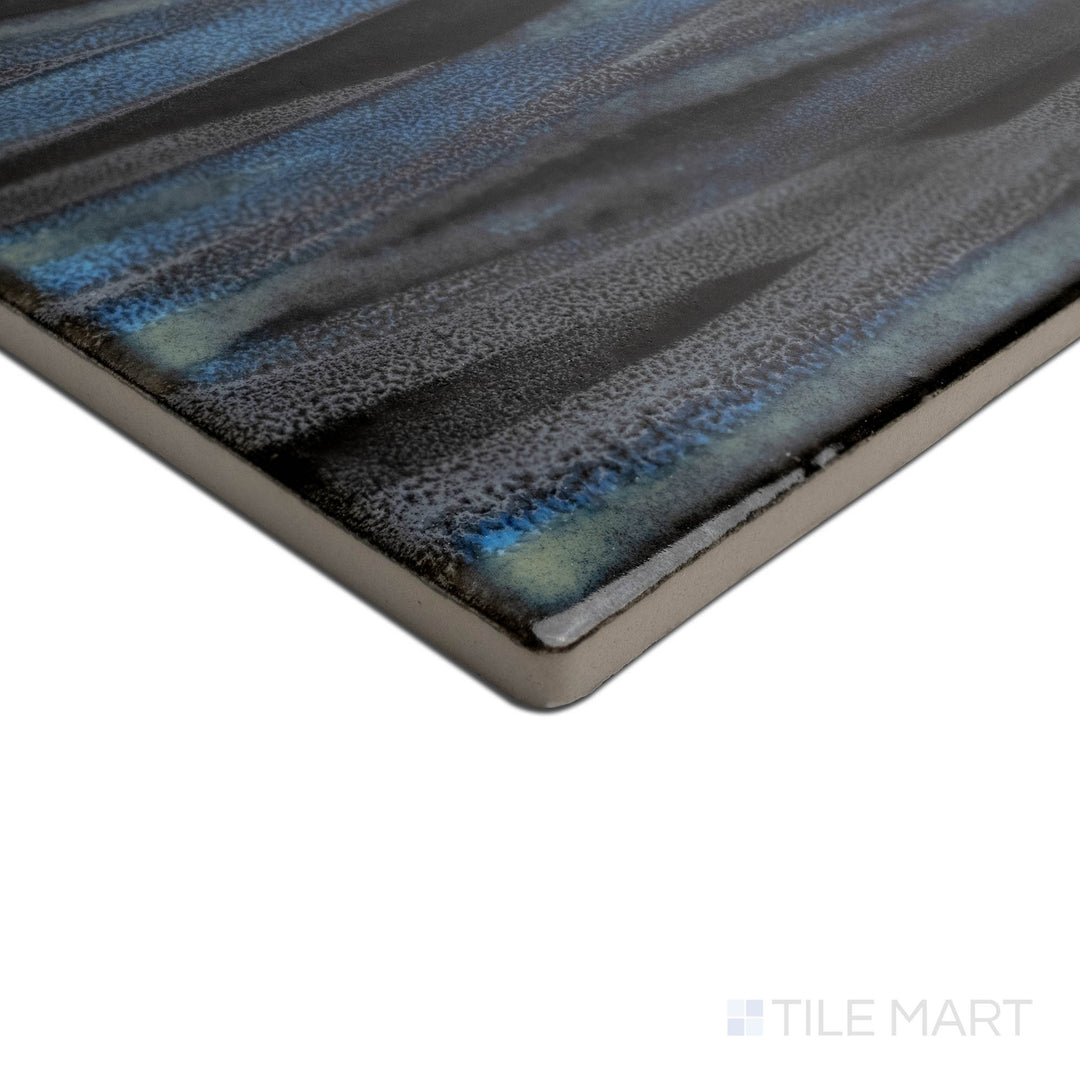 Angled view focusing on the details of KAWA SMOKY BLUE 6X6, capturing the precision-cut edges and rich texture of the PORCELAIN material. The edges offer a sleek, sophisticated finish for detailed designs.