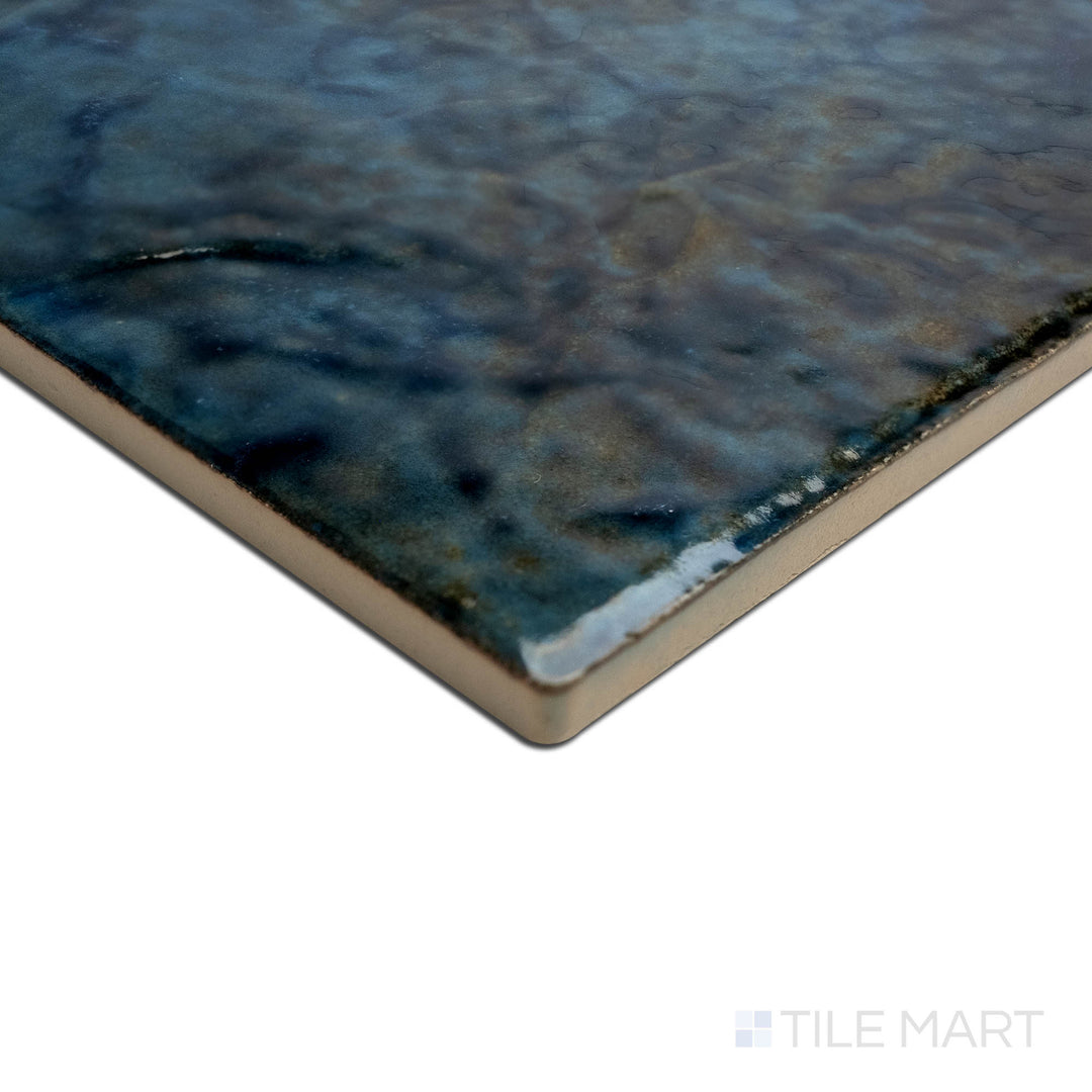 Angled view focusing on the details of SAGA EMERALD 6X6, capturing the precision-cut edges and rich texture of the PORCELAIN material. The clean lines provide a sharp, polished look for intricate tiling projects.