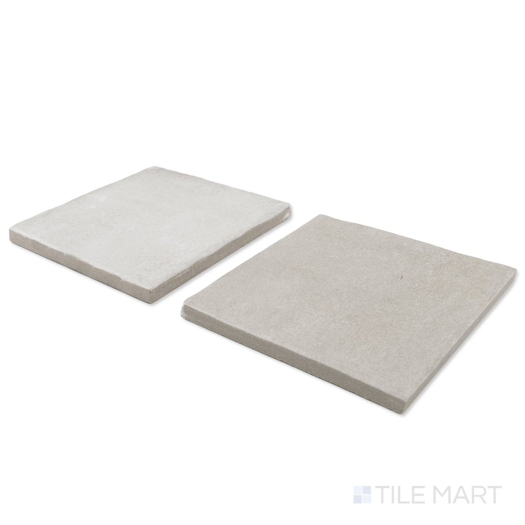 Corner shot of Stage 4x4 white and taupe checkerboard matte porcelain tile revealing its edge profile and soft warm taupe matte surface
