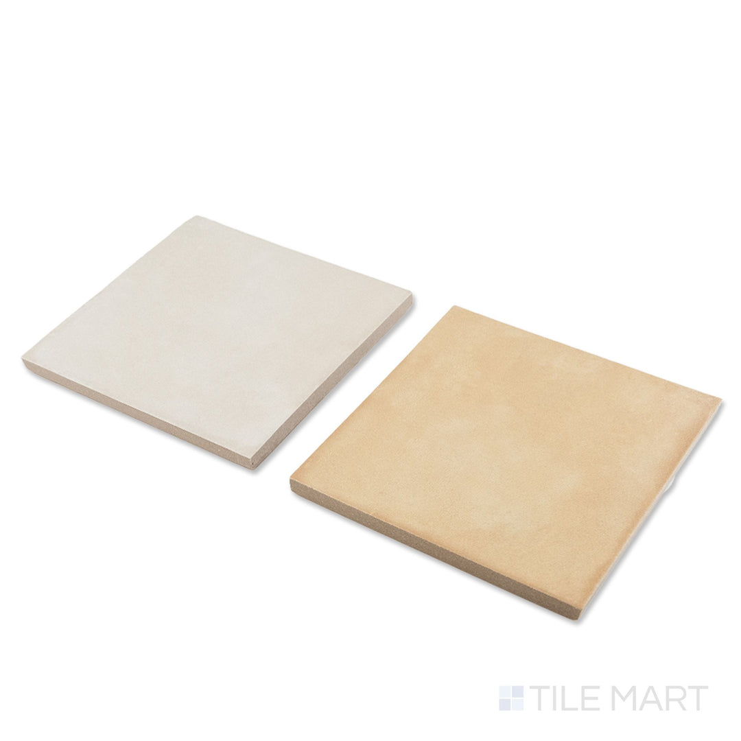 Corner shot of Amuri 8x8 avorio and biscotto checkerboard matte porcelain tile revealing its edge profile and soft warm neutral matte surface