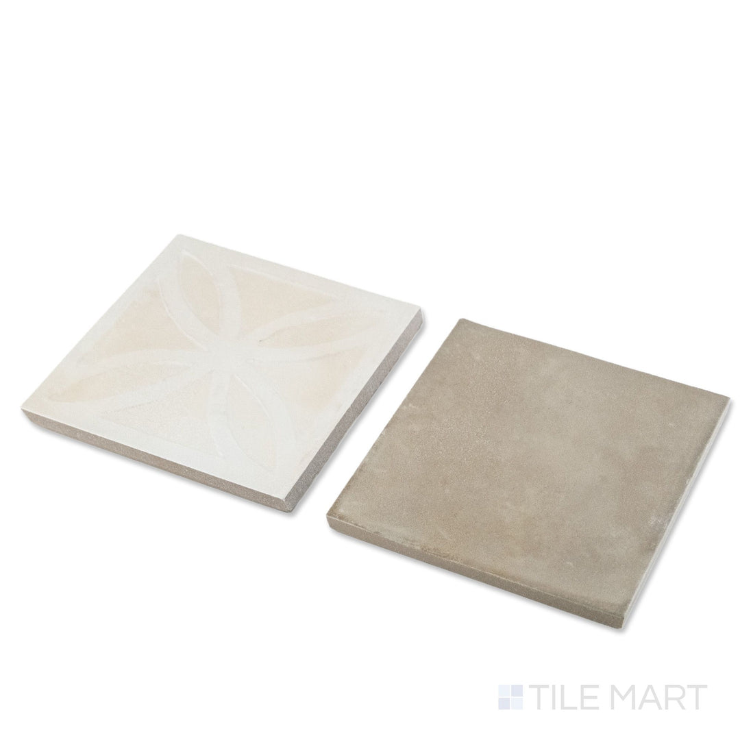 Corner shot of Amuri 8x8 avorio Struttura 3D and grigio checkerboard matte porcelain tile revealing its edge profile and dimensional avorio relief against smooth grigio surface