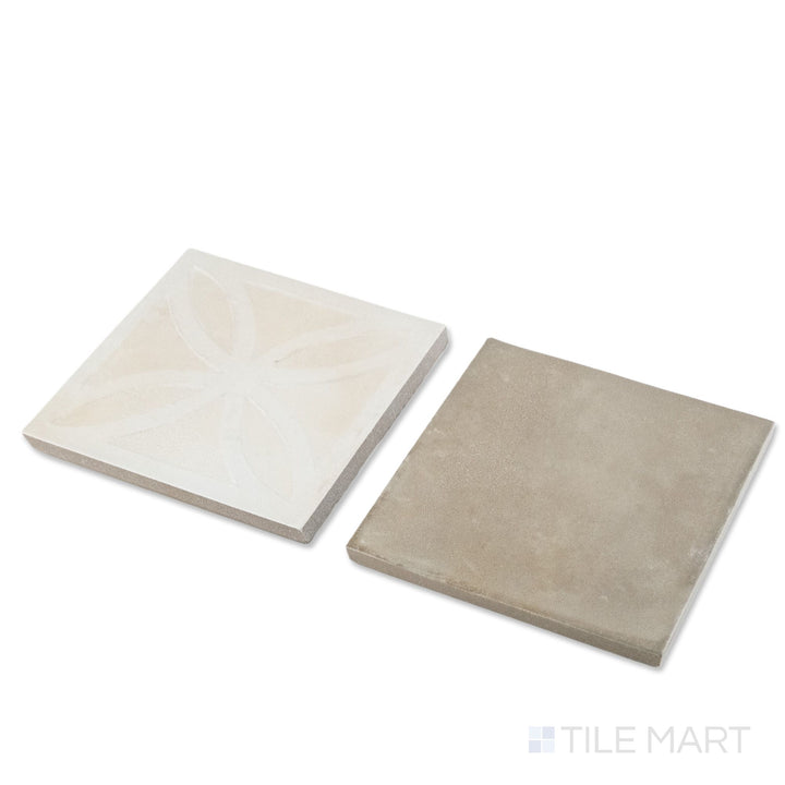 Corner shot of Amuri 8x8 avorio Struttura 3D and grigio checkerboard matte porcelain tile revealing its edge profile and dimensional avorio relief against smooth grigio surface