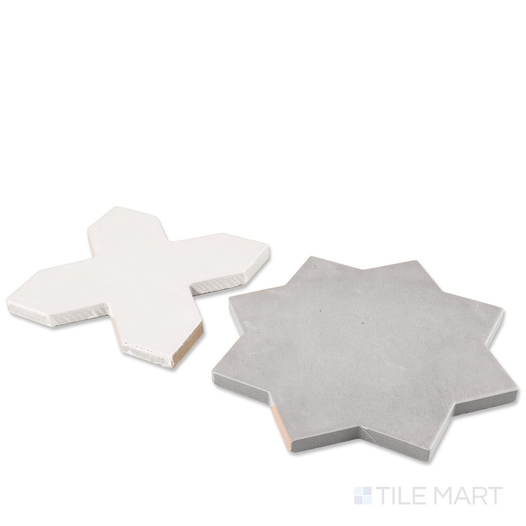 Corner shot of Kasbah bone cross and smoke star checkerboard matte porcelain tile revealing its edge profile and cool moody geometric matte surface