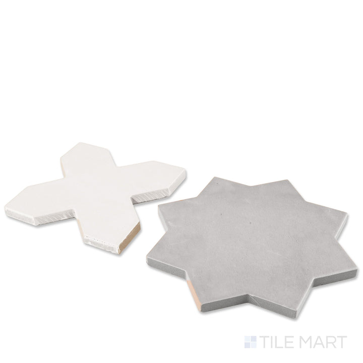 Corner shot of Kasbah bone cross and smoke star checkerboard matte porcelain tile revealing its edge profile and cool moody geometric matte surface