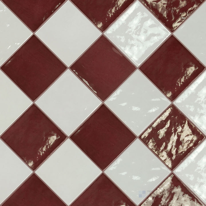 Overview of Village 5x5 white and aubergine checkerboard glossy ceramic tile from an alternate angle highlighting its vibrant two-tone contrast and glossy finish