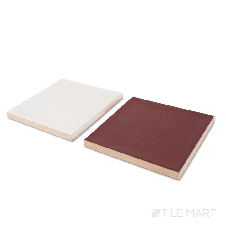 Corner shot of Village 5x5 white and aubergine checkerboard glossy ceramic tile revealing its edge profile and glossy white and aubergine surface