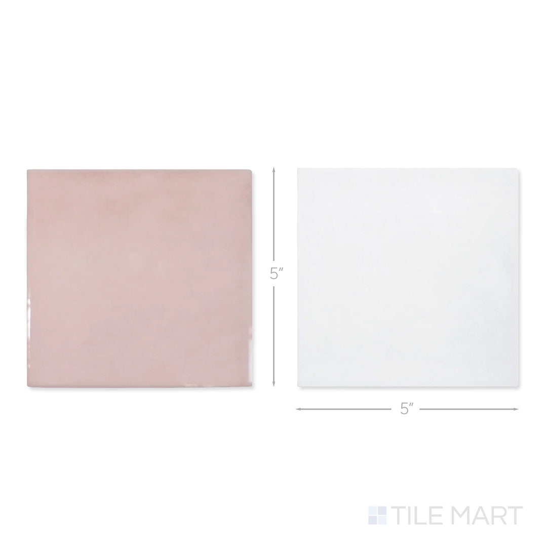 Top-down view of a single Village 5x5 white and rose gold checkerboard glossy ceramic tile showing its light-reflective surface and two-tone finish detail