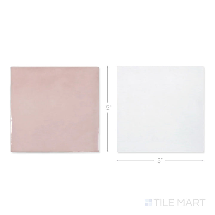 Top-down view of a single Village 5x5 white and rose gold checkerboard glossy ceramic tile showing its light-reflective surface and two-tone finish detail