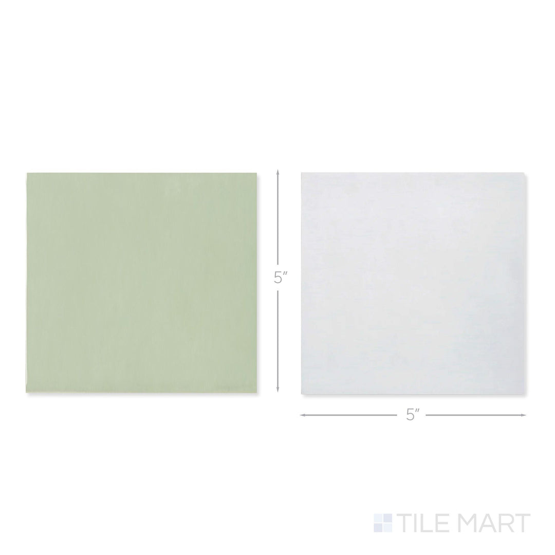 Top-down view of a single Village 5x5 white and mint checkerboard glossy ceramic tile showing its light-reflective surface and two-tone finish detail