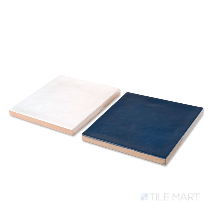 Corner shot of Village 5x5 white and royal blue checkerboard glossy ceramic tile revealing its edge profile and glossy white and royal blue surface