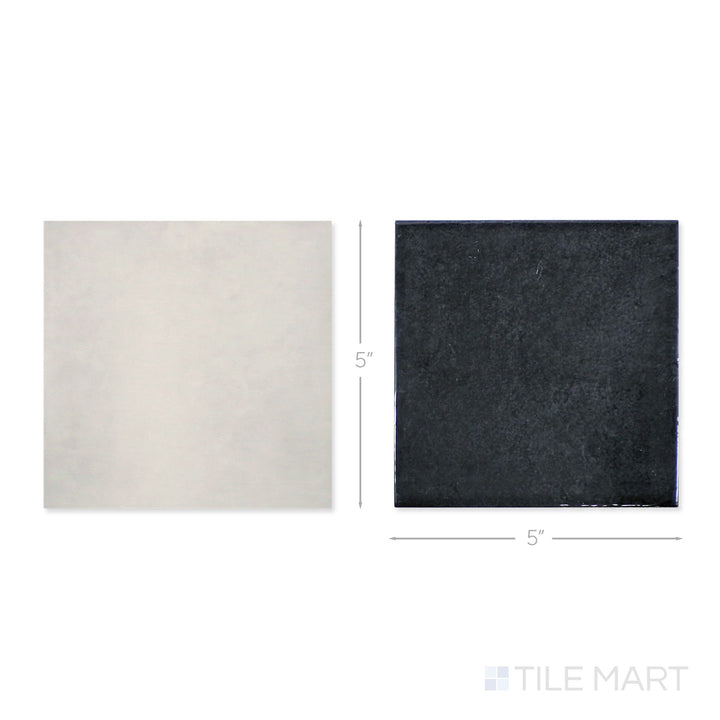 Top-down view of a single Village 5x5 silver mist and black checkerboard glossy ceramic tile showing its light-reflective surface and two-tone finish detail