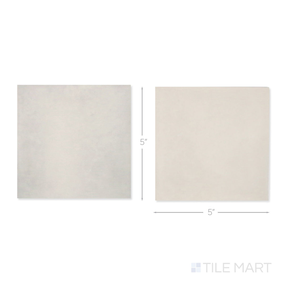 Top-down view of a single Village 5x5 silver mist and mushroom checkerboard glossy ceramic tile showing its light-reflective surface and two-tone finish detail